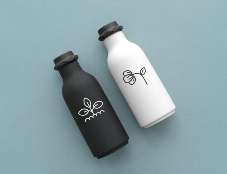 reusable-water-bottles-with-minimal-logo-in-black-and-white-flat-lay.jpg